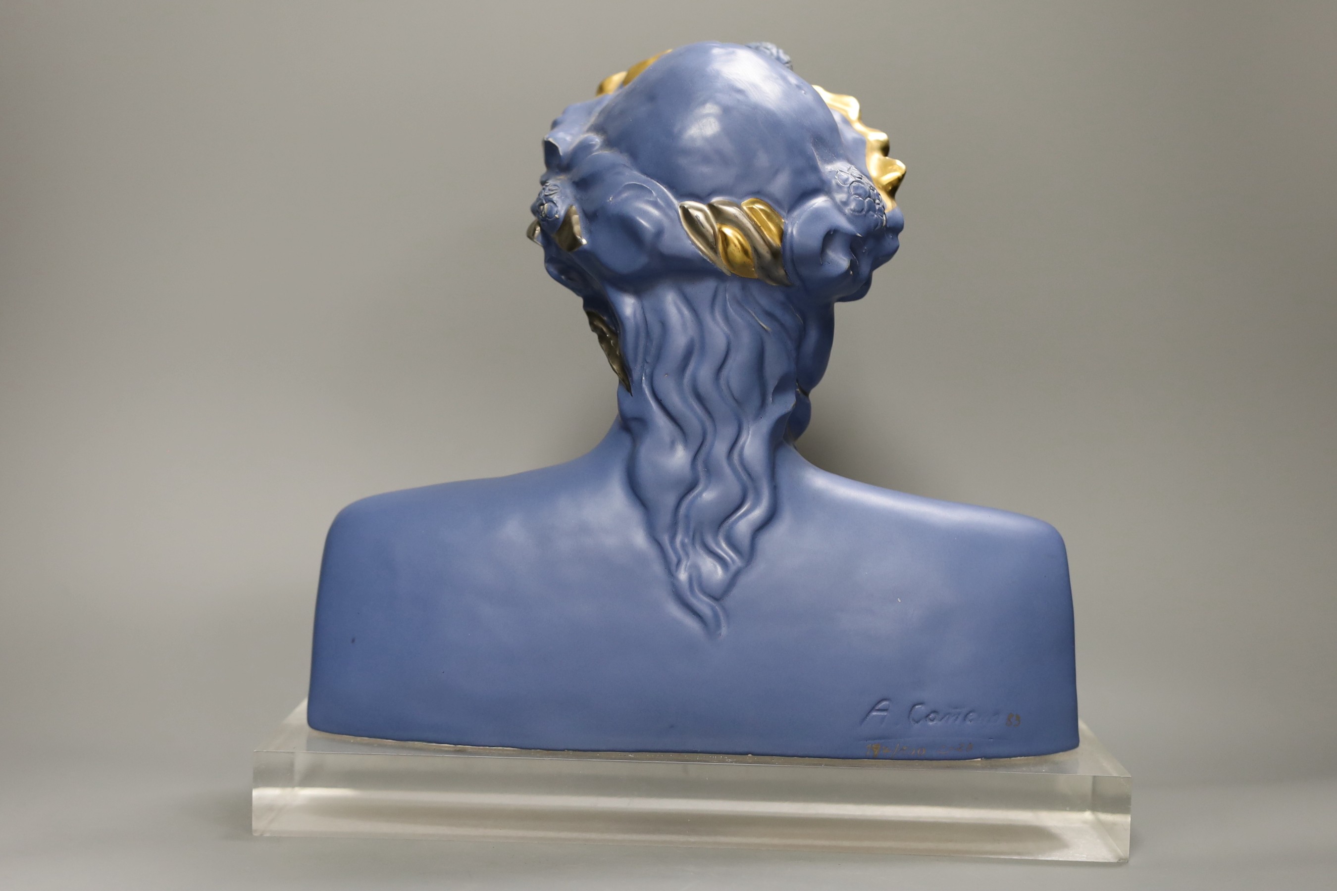 A limited edition blue glazed ceramic bust, signed A.Carreno, 197/500, 29cm tall